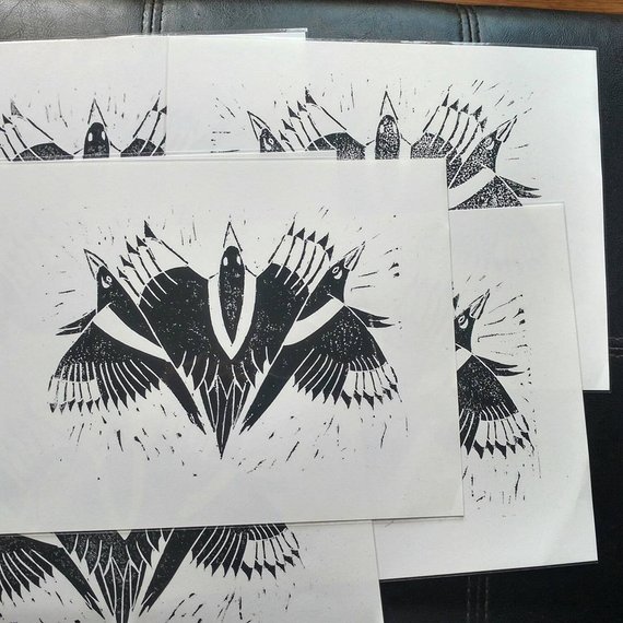An 8x10 blockprint of magpies in black ink
